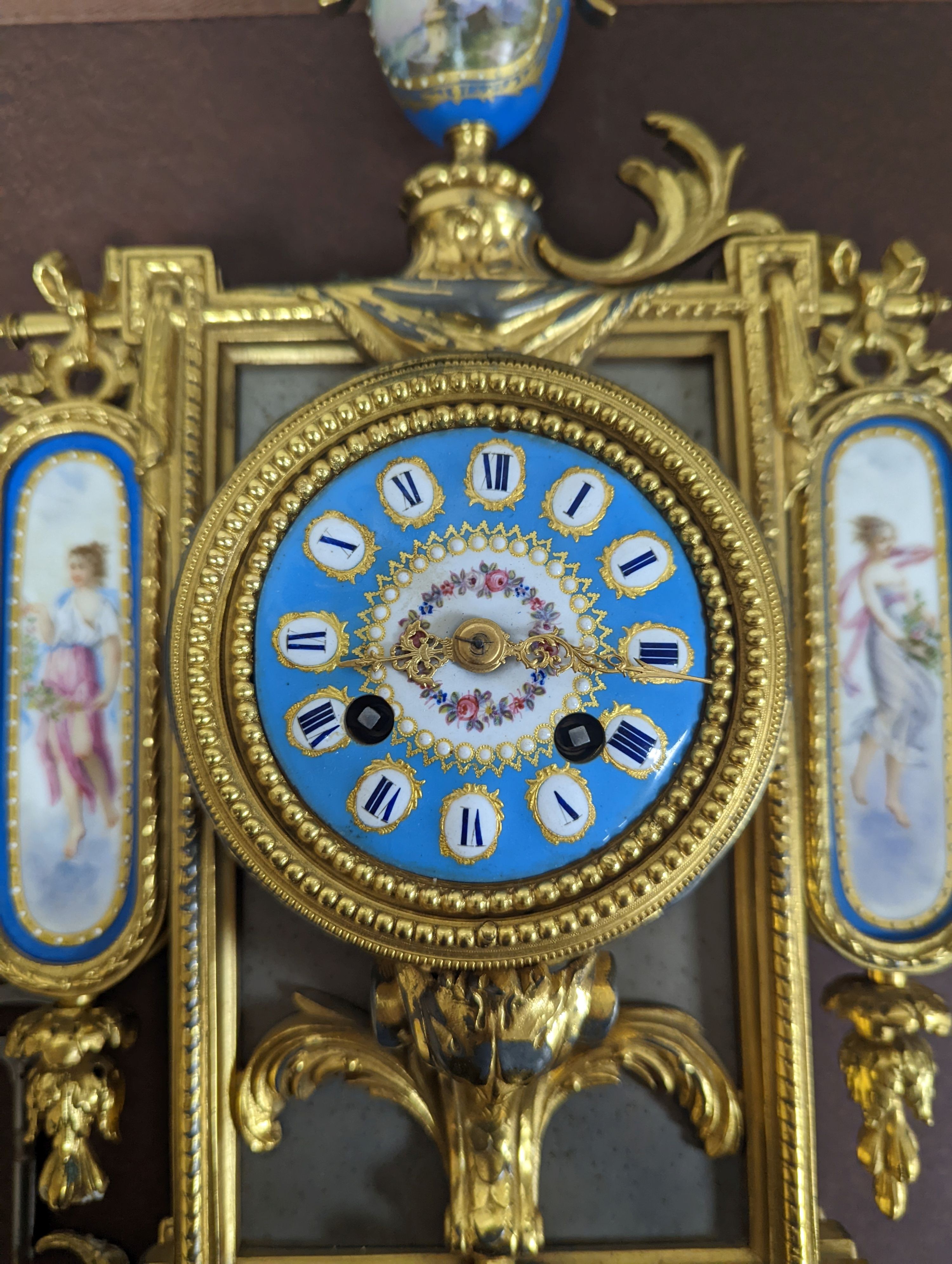 An early 20th century gilt metal and Sevres style porcelain mounted wall clock 58cm